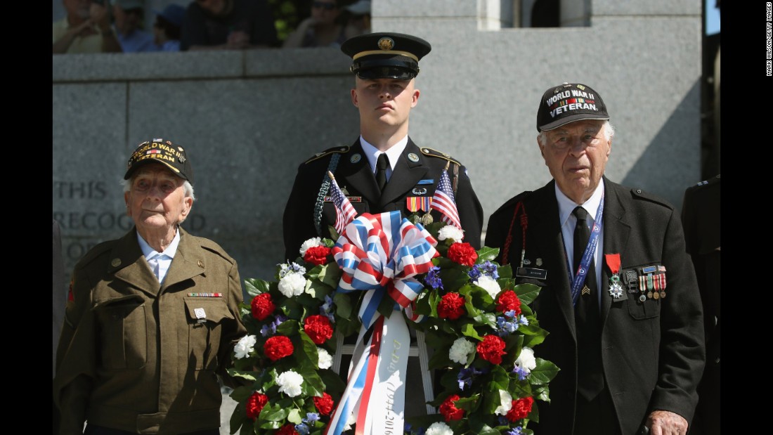D-Day veterans George Krakosky, left, and Herman Zeitchik, right, attend a wreath-laying ceremony at the National World War II Memorial on Monday, June 6. D-Day was the largest amphibious invasion in history. On June 6, 1944, more than 160,000 Allied troops -- about half of them Americans -- &lt;a href=&quot;http://www.cnn.com/2012/06/05/world/gallery/d-day/index.html&quot; target=&quot;_blank&quot;&gt;invaded Western Europe,&lt;/a&gt; overwhelming German forces in an operation that proved to be a turning point in World War II.