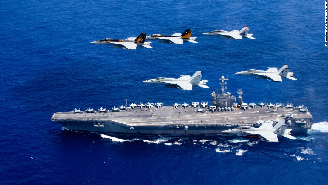 Aircraft fly above the USS John C. Stennis as it travels through the Philippine Sea on Saturday, June 18.