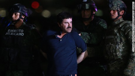 Guzman is escorted by Mexican security forces at a Navy hangar in Mexico City, Mexico in 2016. 