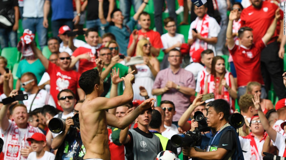 Poland forward Robert Lewandowski celebrates his team&#39;s victory over Switzerland in a penalty shoot-out Saturday, June 25, at the Geoffroy-Guichard stadium in Saint-Etienne, France.