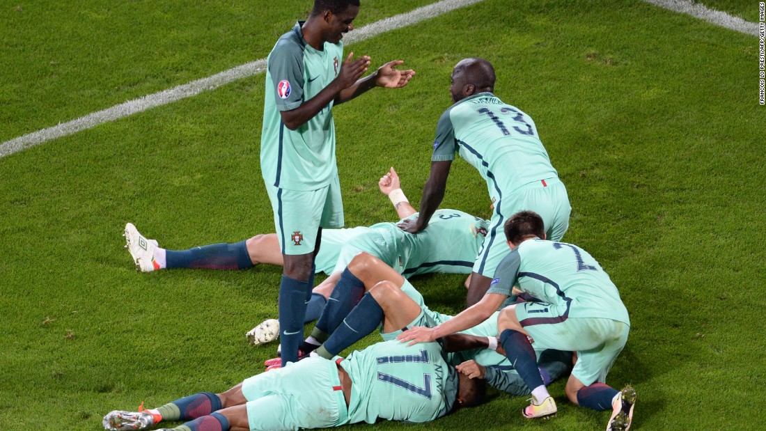 Portugal players celebrate at the end of the match. 