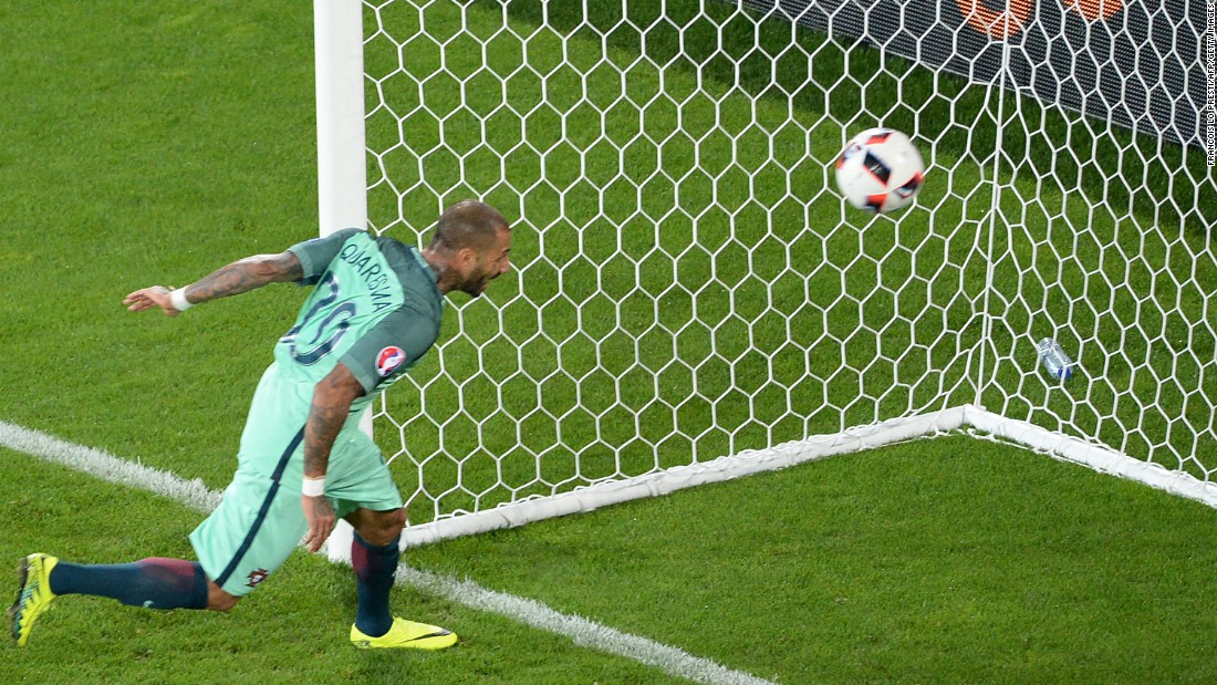 Portugal forward Ricardo Quaresma heads the ball to score a goal in extra time.