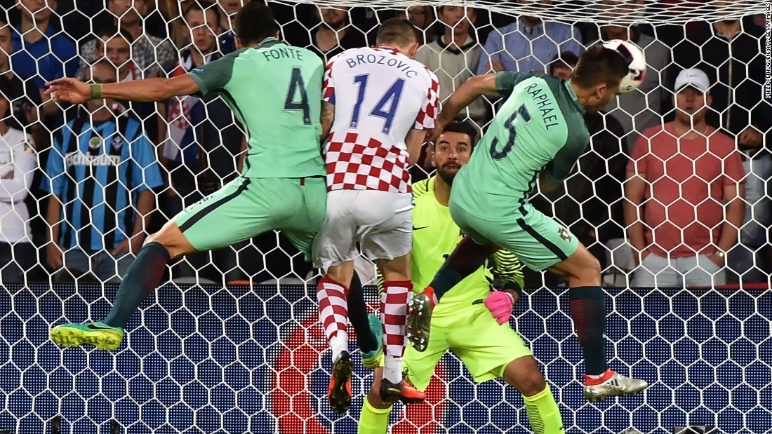 Croatia midfielder Marcelo Brozovic, second left, vies with Portugal defenders Jose Fonte, left, and Raphael Guerreiro, right, in front of Portugal goalkeeper Rui Patricio.