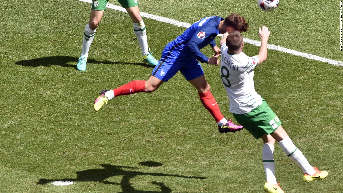 France forward Antoine Griezmann heads the ball to score.