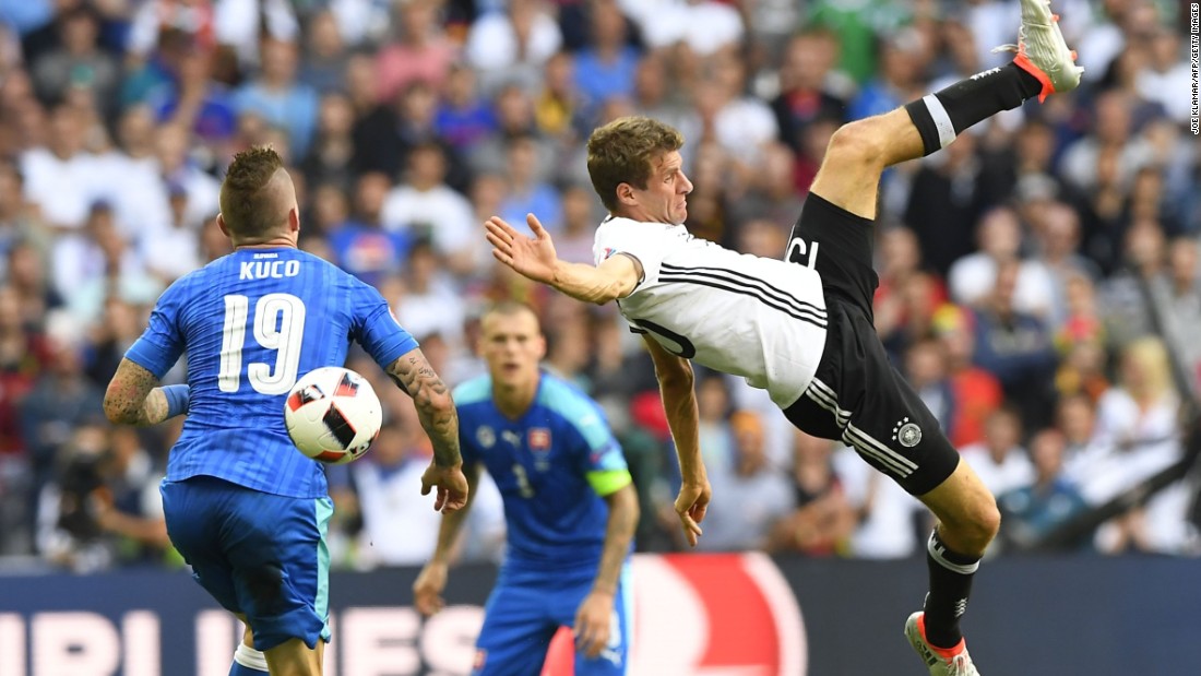 Germany&#39;s midfielder Thomas Mueller, right, challenges Slovakia&#39;s midfielder Juraj Kucka.