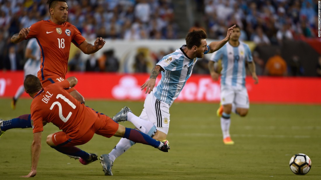 Argentina&#39;s Lionel Messi, right,  is fouled by Chile&#39;s Marcelo Diaz.