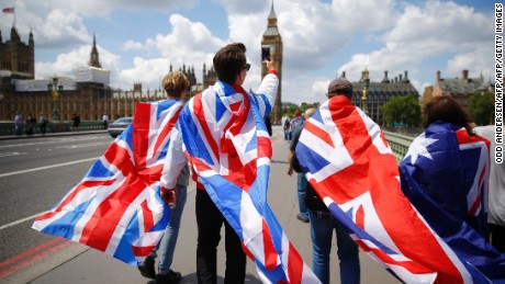 People walk over Westminster Bridge wrapped in Union flags, towards the Queen Elizabeth Tower (Big Ben) and The Houses of Parliament in central London on June 26, 2016. 
Britain&#39;s opposition Labour party plunged into turmoil Sunday and the prospect of Scottish independence drew closer, ahead of a showdown with EU leaders over the country&#39;s seismic vote to leave the bloc. Two days after Prime Minister David Cameron resigned over his failure to keep Britain in the European Union, Labour leader Jeremy Corbyn faced a revolt by his lawmakers who called for him, too, to quit.
 / AFP / Odd ANDERSEN        (Photo credit should read ODD ANDERSEN/AFP/Getty Images)