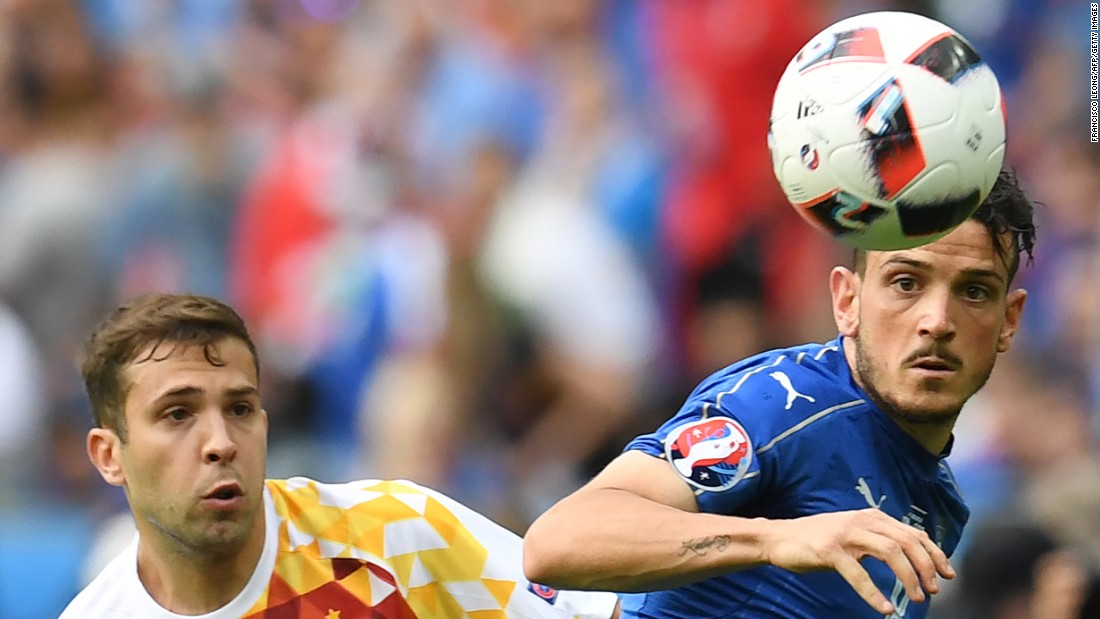 Spanish midfielder Koke, left, eyes the ball next to Italy&#39;s Alessandro Florenzi.