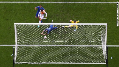 Giorgio Chiellini of Italy scores against Spain in Euro 2016. 