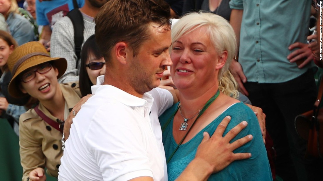 Willis celebrates with his mother after a straight-sets victory over world No. 54 Ricardas Berankis in his first senior appearance at the grass-court tournament.    