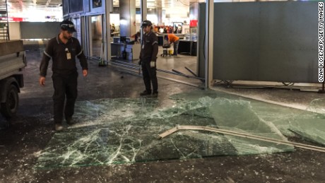 Authorized personnel clear glass debris in Ataturk airport&#39;s International arrival terminal on Wednesday, June 29.