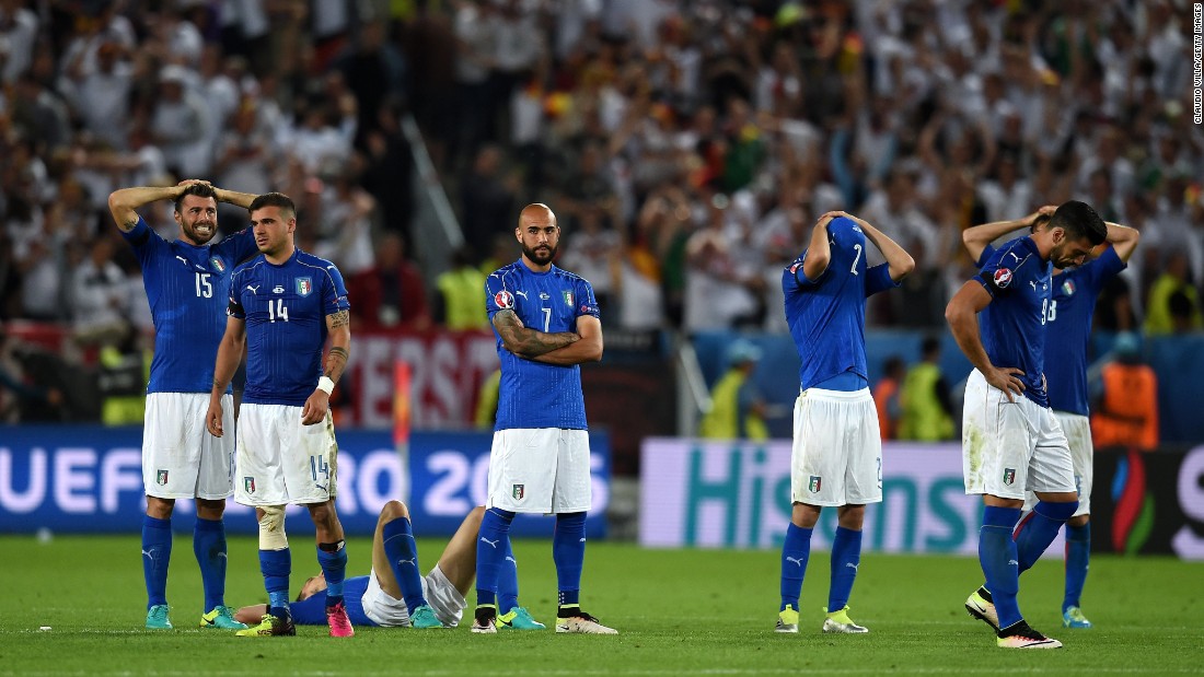 Italy players react after their defeat after the penalty shootout.