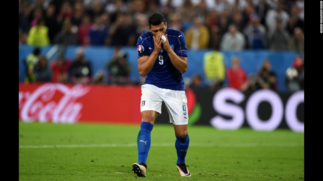 Graziano Pelle of Italy reacts after missing his penalty shot.