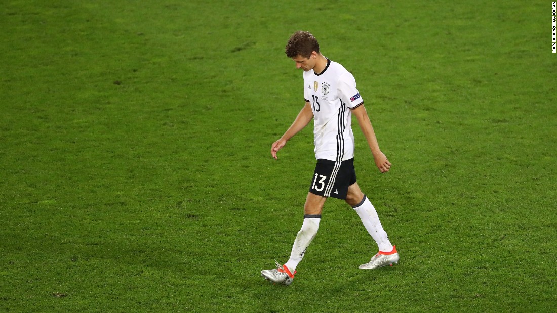 Thomas Mueller of Germany walks off after his penalty was saved by Italy&#39;s Gianluigi Buffon.