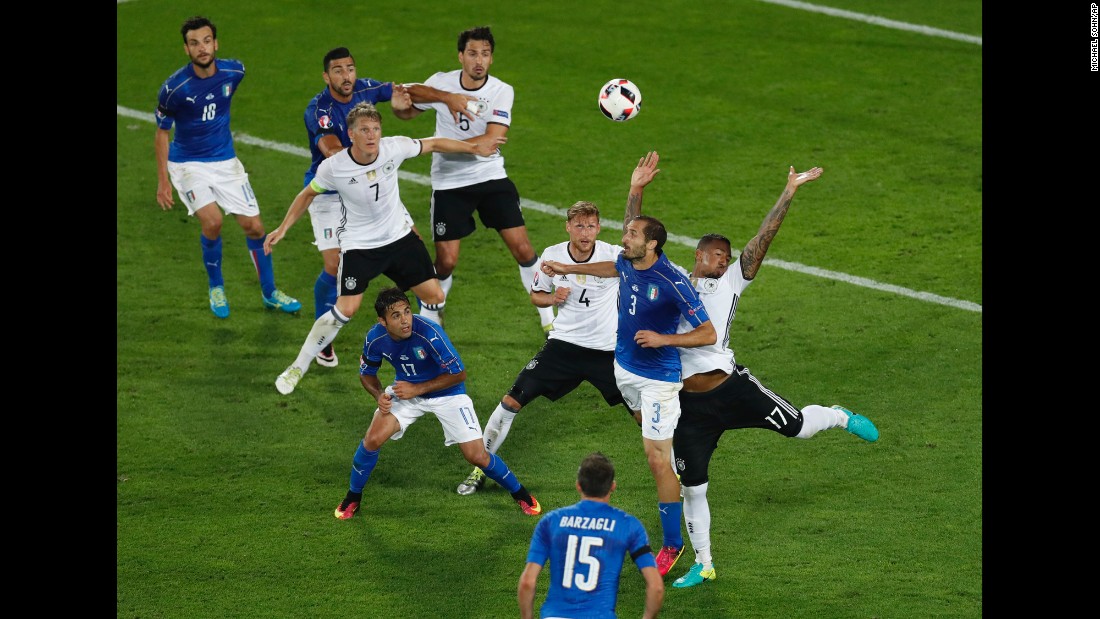 Italy&#39;s Giorgio Chiellini, right, is fouled by Germany&#39;s Jerome Boateng.