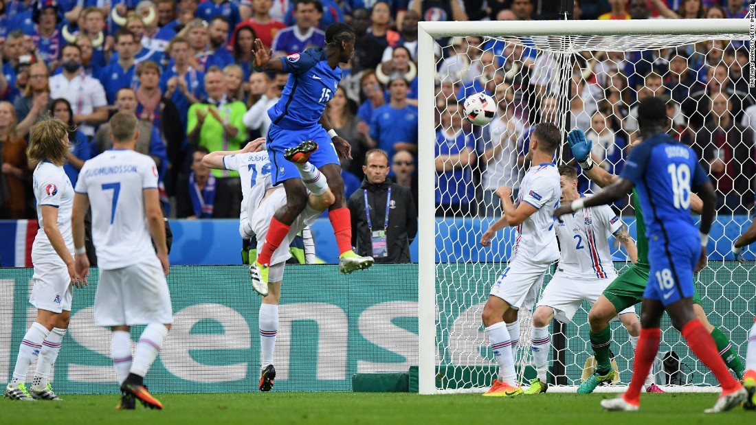 Paul Pogba, fourth from left, of France heads the ball to score his team&#39;s second goal.