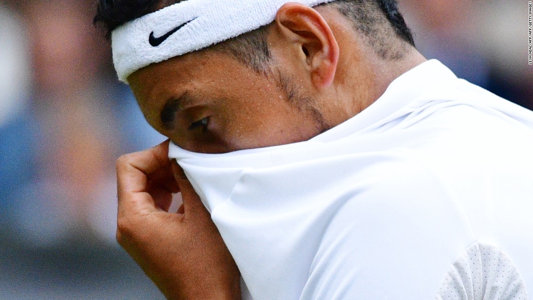 Nick Kyrgios reacts while playing Britain&#39;s Andy Murray during their men&#39;s singles fourth round match. Australian Kyrgios -- who plays without a coach -- appeared distracted throughout the match. 