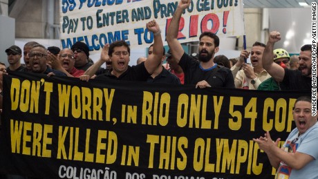 Police and firefighters protest over pay Monday at the Rio de Janeiro airport.