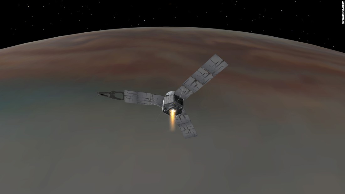 An illustration depicts NASA&#39;s Juno spacecraft entering Jupiter&#39;s orbit. Juno will study Jupiter from a polar orbit, coming about 3,000 miles (5,000 kilometers) from the cloud tops of the gas giant.