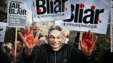 A Stop the War Coalition protester, wearing a mask depicting Former Prime Minister Tony Blair, shows bloodied hands on January 29, 2015 in London, England.