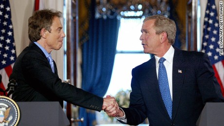 US President George W. Bush shakes hands with British Prime Minister Tony Blair in the Cross Hall of the White House during a press conference 17 July, 2003, in Washington, DC. The Iraq war allies are facing mounting criticism from both their countries over bad intelligence before the war. Blair maintained the accuracy of British intelligence on Iraq&#39;s purchase of nuclear material from Niger, saying &#39;we know for sure&#39; that it bought 270 tons of the material from the African country in the 1980s