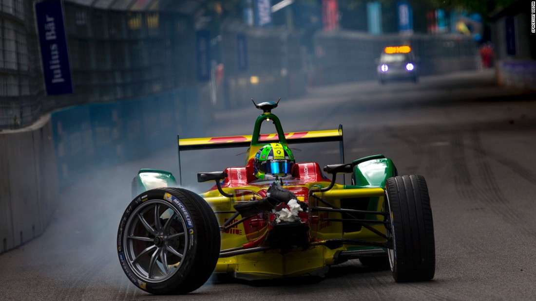 Lucas di Grassi limps back to the pit lane after crashing into the back of Sebastien Buemi in Sunday&#39;s final race. The Brazilian ended up two points behind eventual championship winner Buemi.  