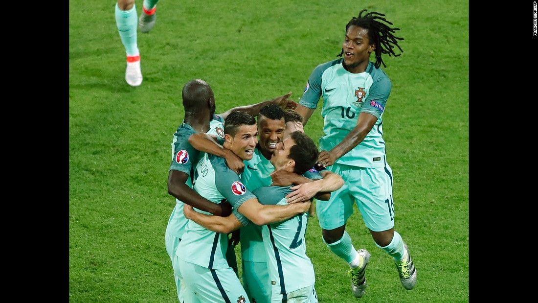 Portuguese players celebrate their second goal, which was scored by Nani in the 53rd minute.