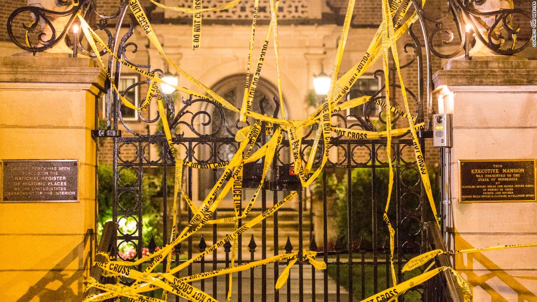 Community members and activists covered the governor&#39;s residence with police tape from the scene where Castile was killed.