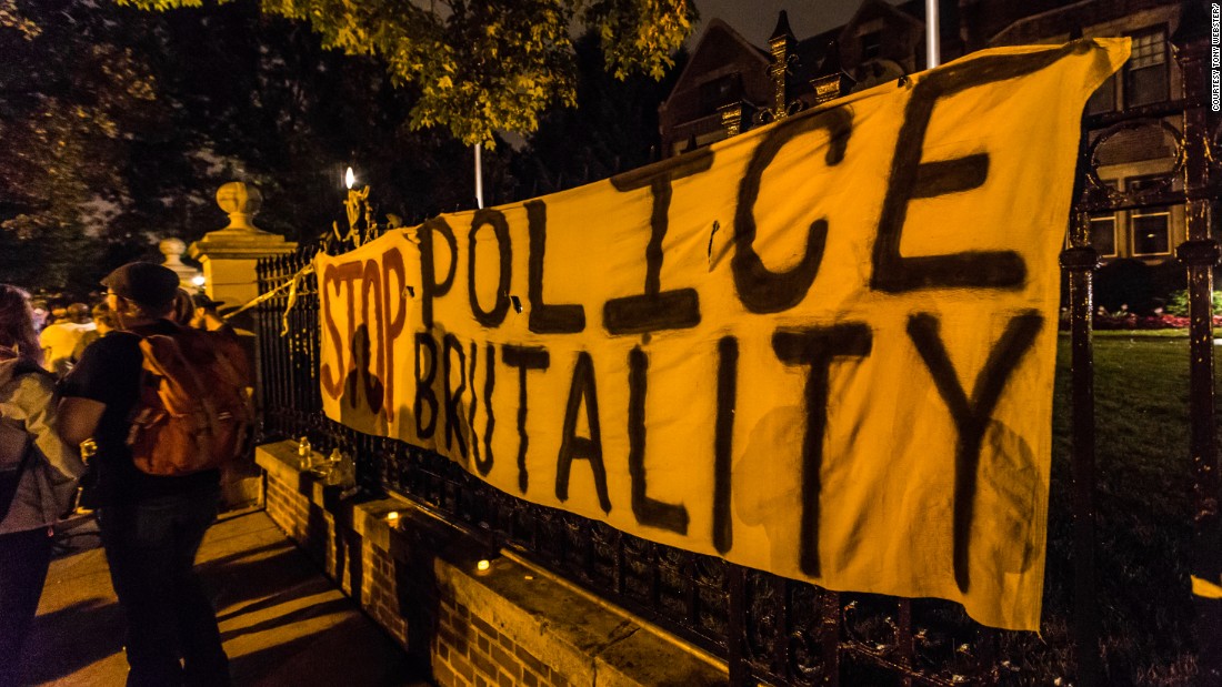 Community members and activists gather outside the Minnesota governor&#39;s home.