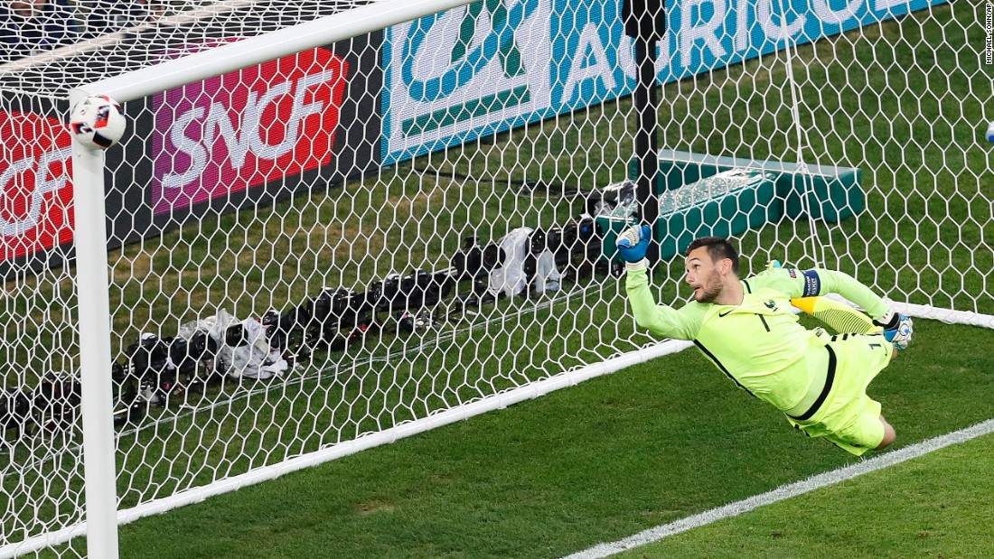 French goalkeeper Hugo Lloris watches as a shot from Germany&#39;s Joshua Kimmich hits the post late in the second half.