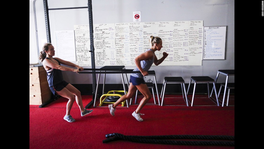 Koroleva, right, does exercises with U.S. team member Phoebe Coffin.