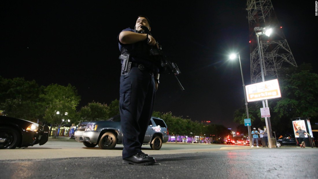 Dallas police stand watch after the shootings.