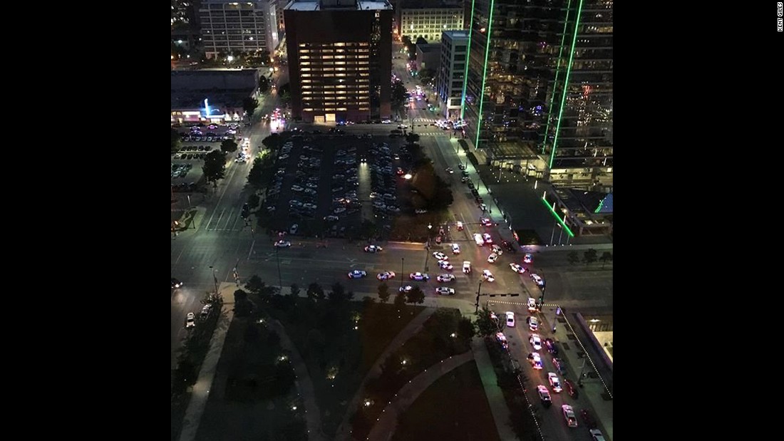 A view of downtown Dallas after the shootings. Kent Giles captured the image and told CNN he &quot;heard multiple shots being fired. Probably more than 20 rounds. This is the intersection of Main and Griffin looking towards the west.&quot;