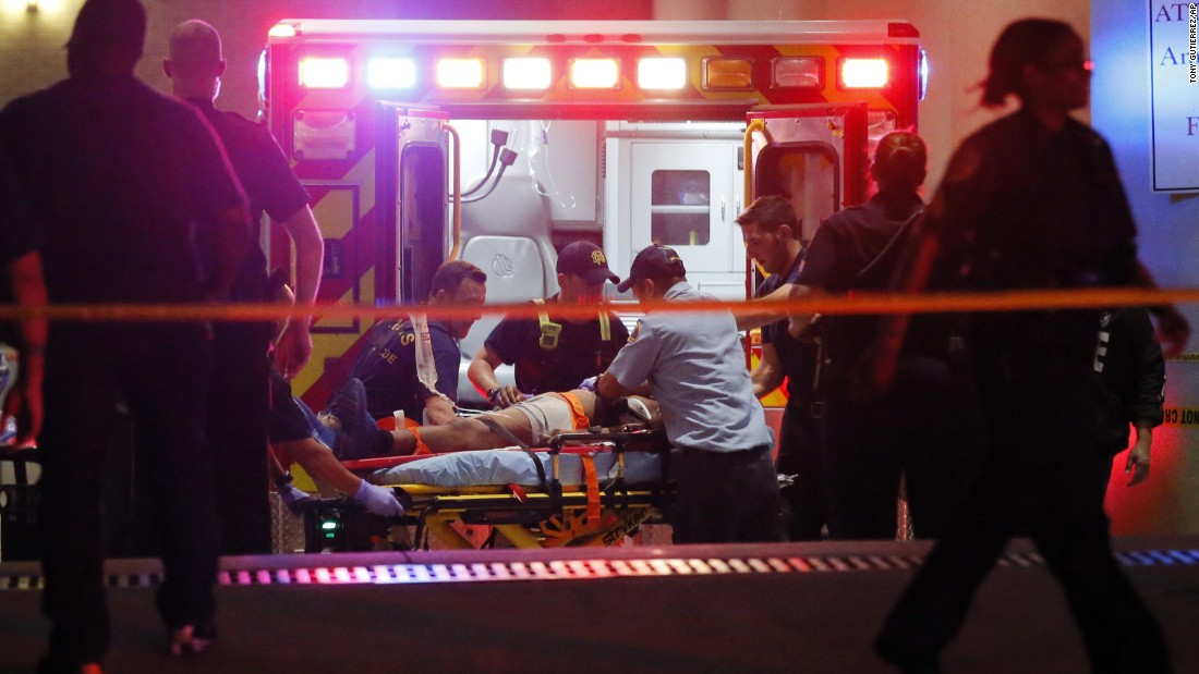 Emergency responders administer CPR to an unknown patient near the receiving area of the Baylor University Medical Center.