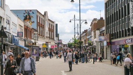 Saturday morning shoppers stream down Romford&#39;s high street. 