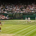 Federer vs Raonic wimbledon semifinal action shot 