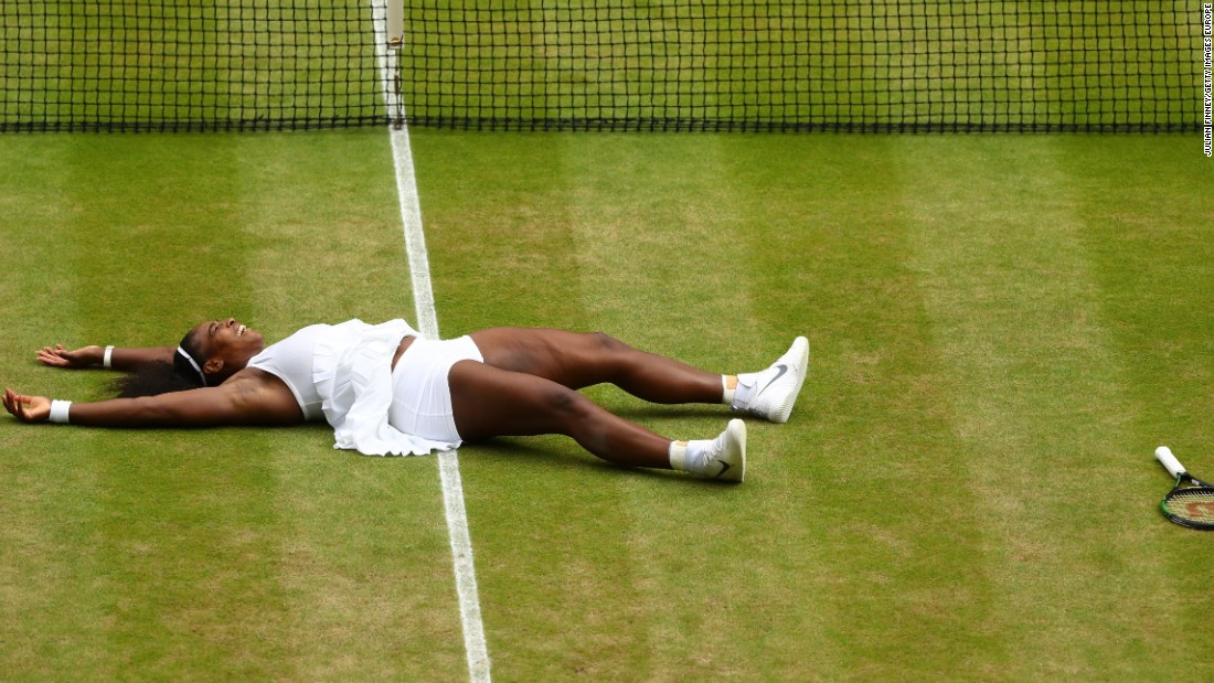 Williams lies on the ground after clinching her victory against Kerber to win Wimbledon for the seventh time.  