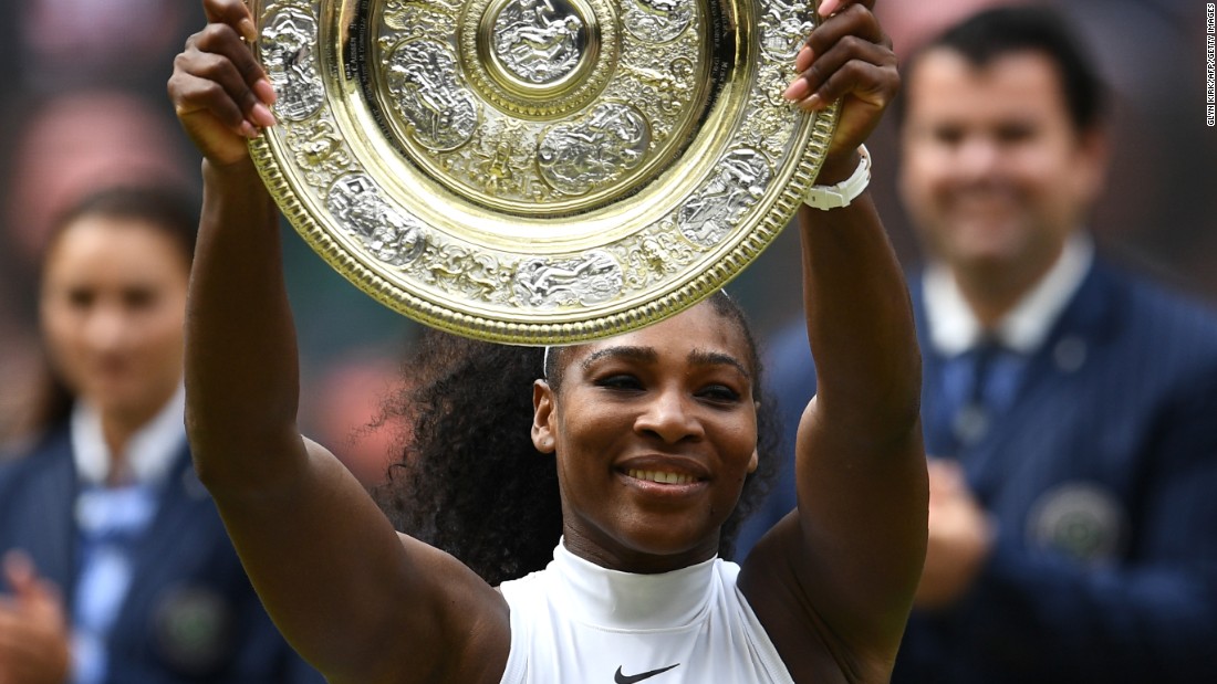 Serena Williams poses with the Venus Rosewater Dish after her women&#39;s singles final victory over Germany&#39;s Angelique Kerber. 