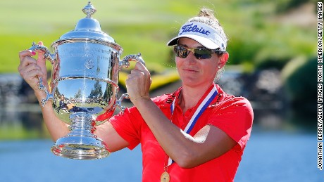 Brittany Lang poses with the trophy after defeating Anna Nordqvist to win the U.S. Women&#39;s Open.