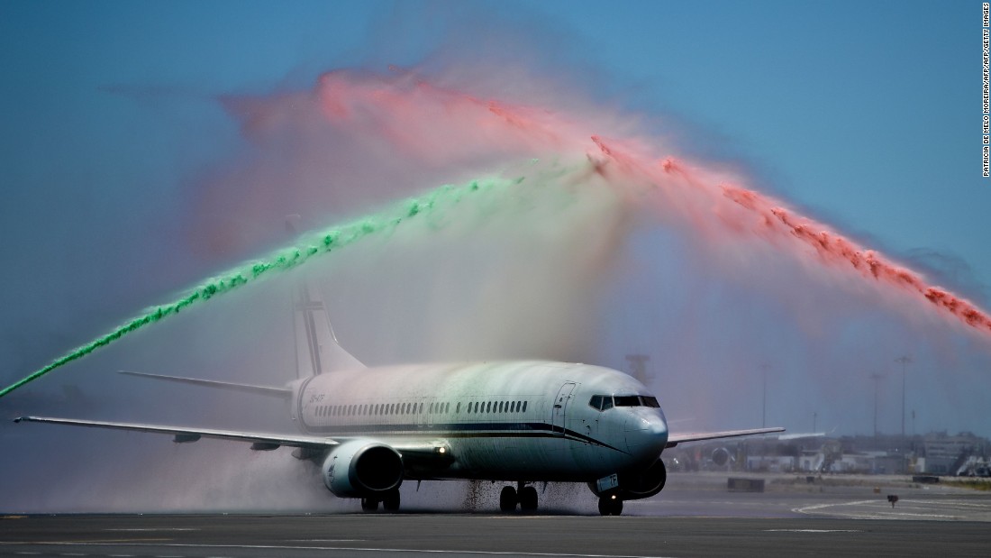As their plane touched down in Lisbon, the players were welcomed back by an airport firefighters&#39; unit spraying water over the aircraft in the national colors. 