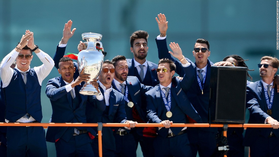 An open-top bus paraded the stars through the streets of Lisbon as the players showed off the trophy -- the nation&#39;s first at a major football tournament, and some consolation after losing the 2004 final on home soil. 