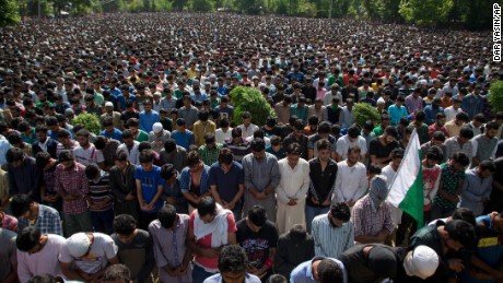 Villagers pray during Saturday&#39;s funeral for militant commander Burhan Wani. 