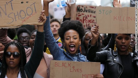 Demonstrators make their way Sunday through London to show their solidarity with the U.S. protests.