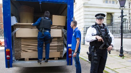 A moving van loaded with cardboard boxes is inspected by police before entering Downing Street on July 12, 2016 in London, England. 