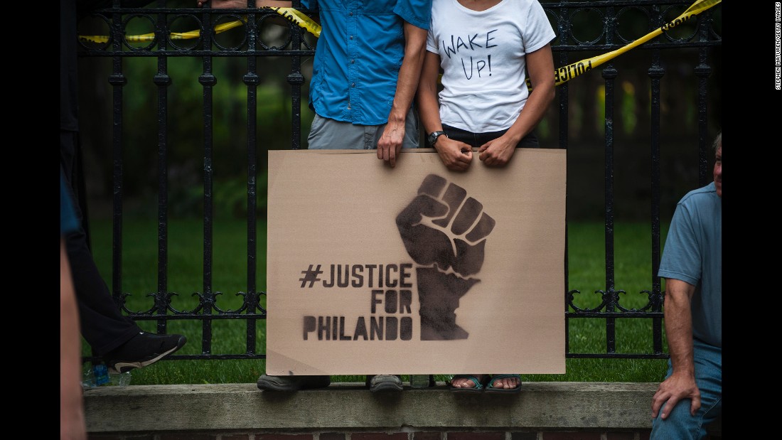 A couple hold a sign protesting the &lt;a href=&quot;http://www.cnn.com/2016/07/07/us/falcon-heights-shooting-minnesota/&quot; target=&quot;_blank&quot;&gt;killing of Philando Castile&lt;/a&gt; outside the governor&#39;s mansion on July 7, in St. Paul, Minnesota. Castile&#39;s death was live-streamed by his fiancée and quickly went viral.