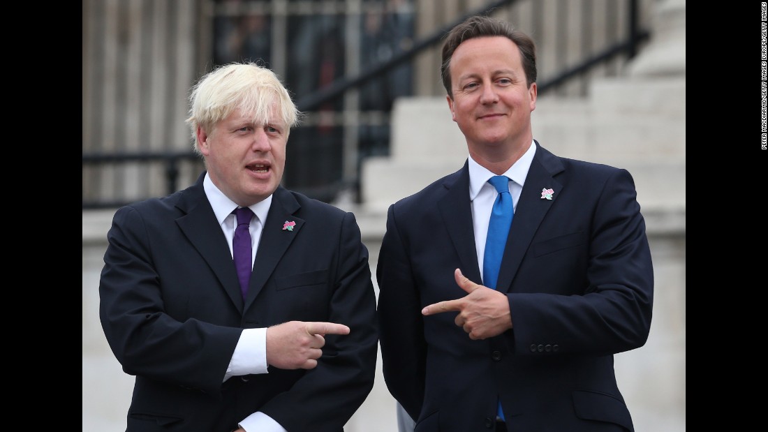 Cameron stands beside the then London Mayor Boris Johnson as the Olympic cauldron is lit for the Paralympic Games on August 24, 2012 in London.