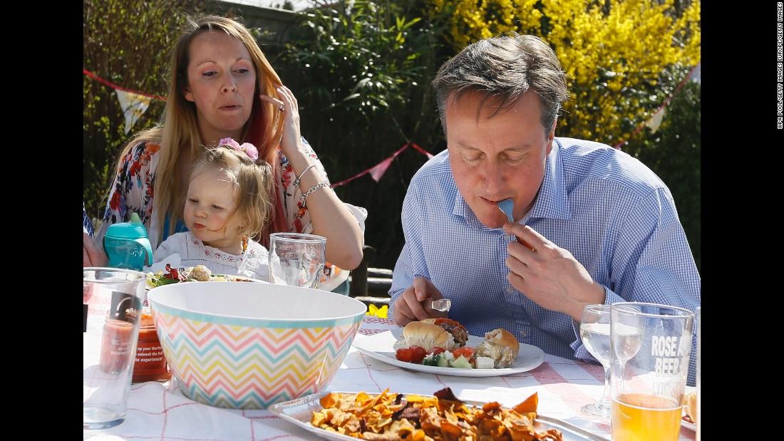 Cameron is captured on camera eating a hot dog with a knife and fork during the 2015 general election campaign.