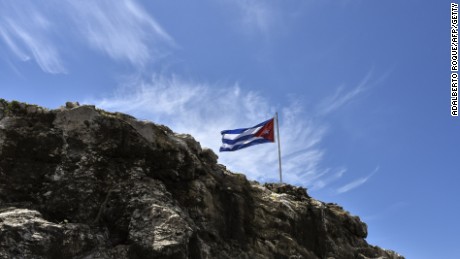 A Cuban flag flutters on top of a rock near the U.S. Embassy in Havana on August 13, 2015.