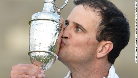 Zach Johnson kisses a claret pitcher after winning the 144th Open Championship in 2015.