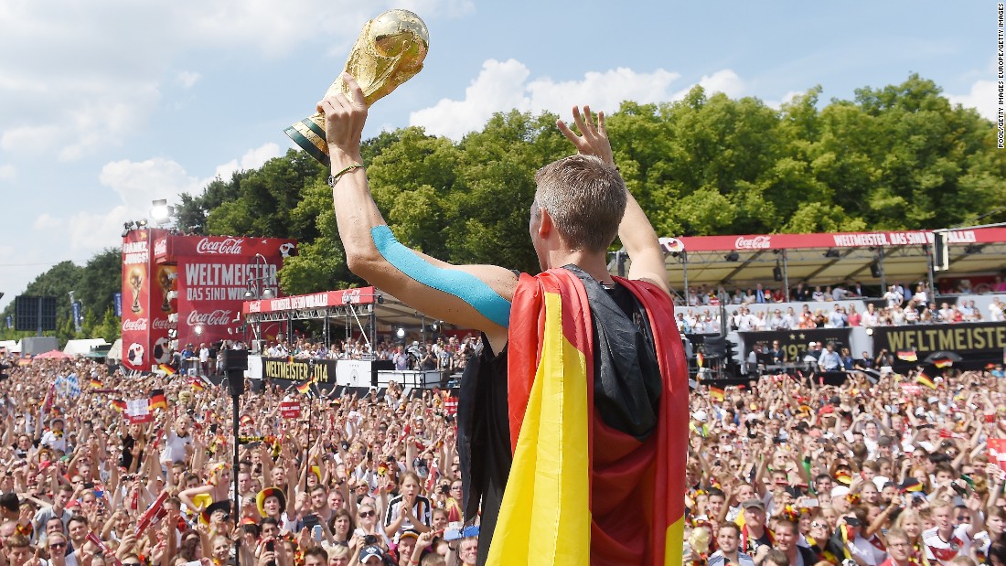 Schweinsteiger showed off the World Cup trophy in Berlin as Germany celebrated winning 2014 tournament in Brazil. 